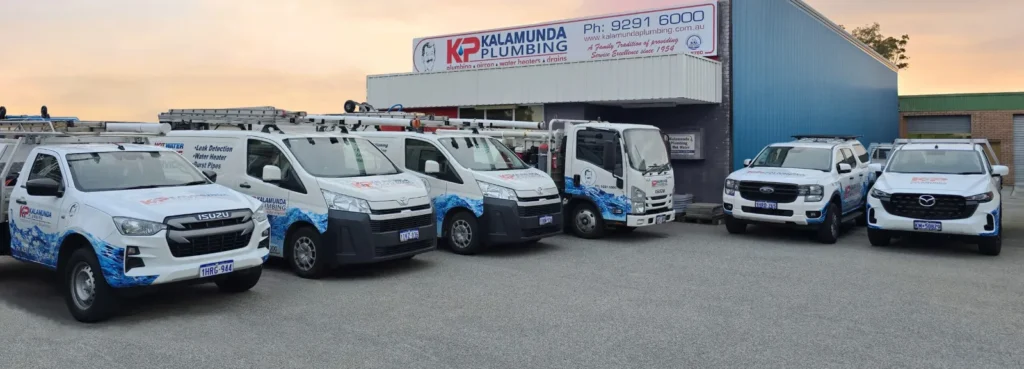 Kalamunda Plumbing depot with branded service trucks and utes